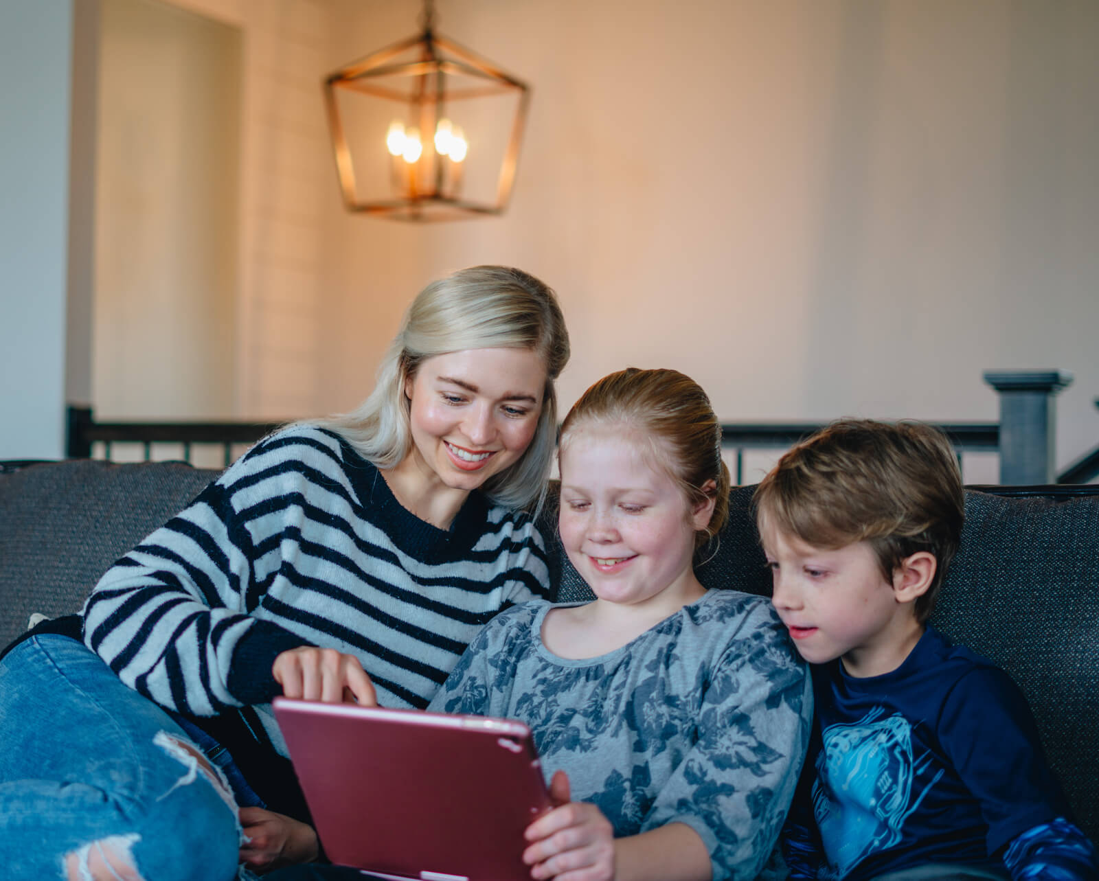 Mom and kids watching church on ipad